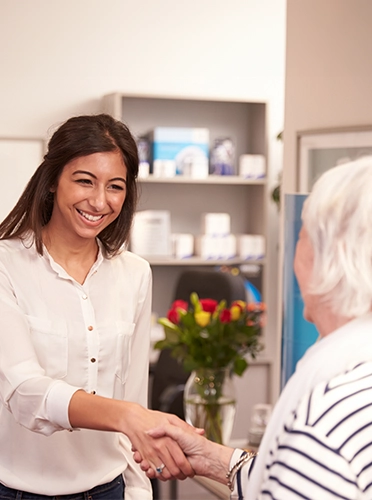 Dentist Falmouth MA Ladies Shaking Hands