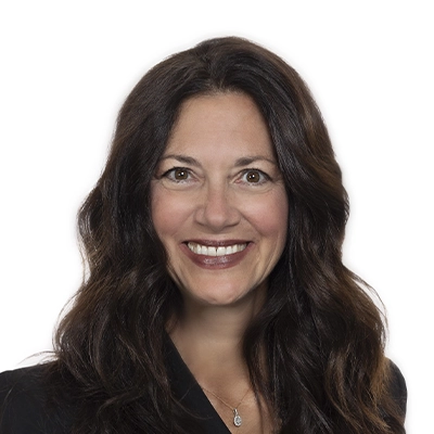 Headshot of Dr. Lori Fitzgerald smiling in a white background.